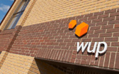 WUP Studios entrance, situated in a modern business park with convenient parking outside the door